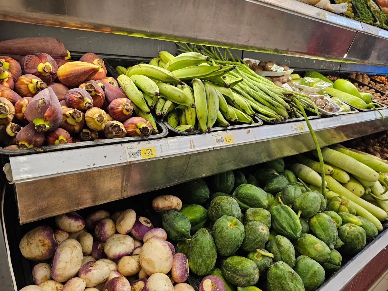 A market display of mixed fresh vegetables